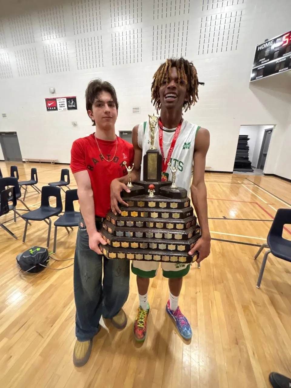 Simon Maxam playing basketball with a friend