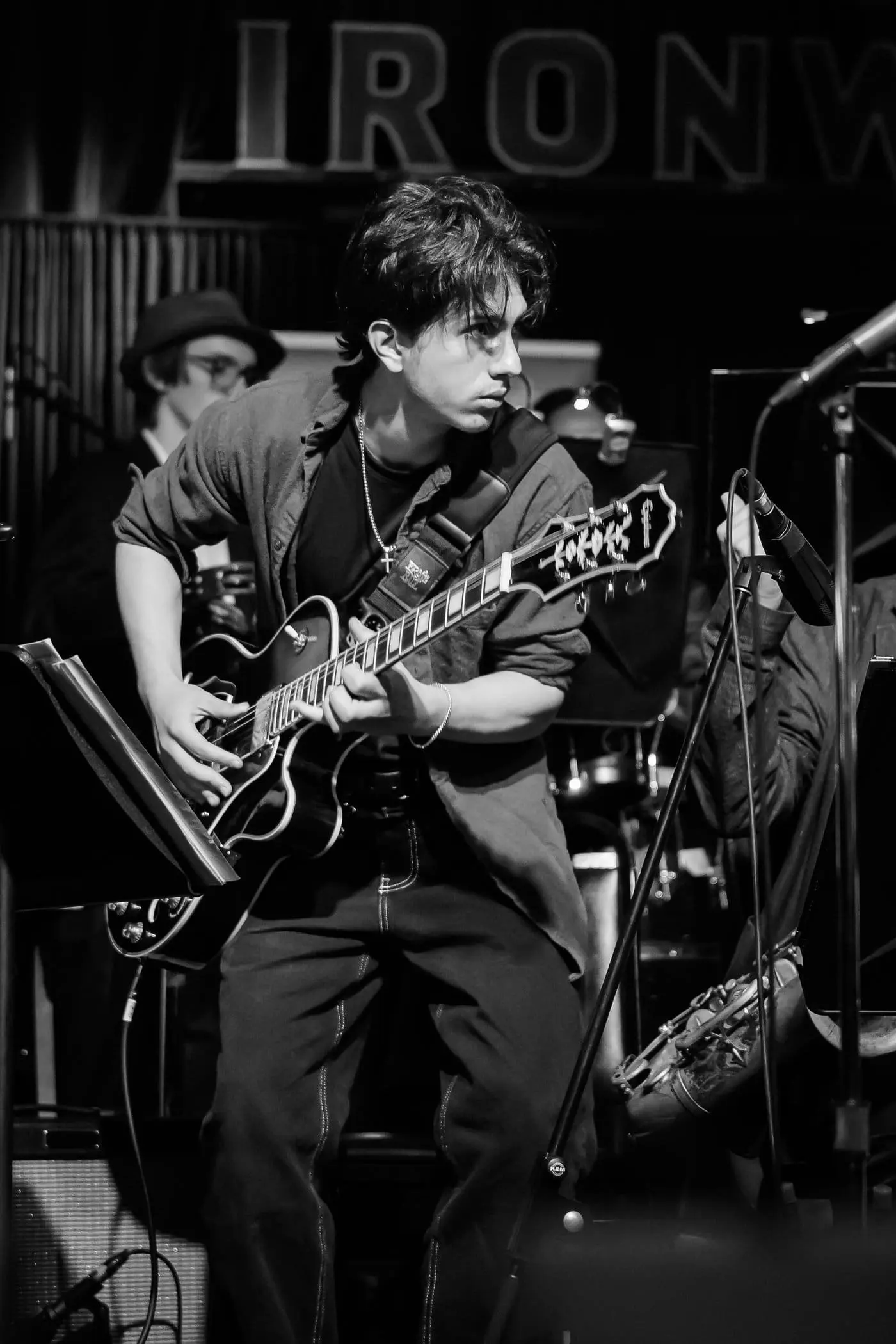 Simon Maxam playing acoustic guitar